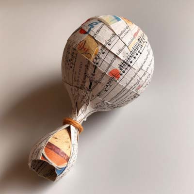 maraca covered in newsprint