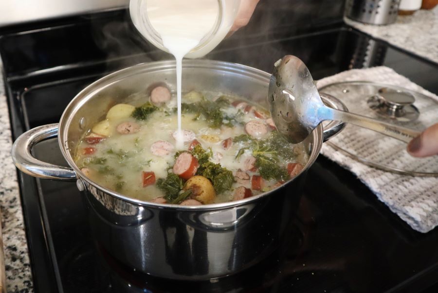 pouring buttermilk into soup pot